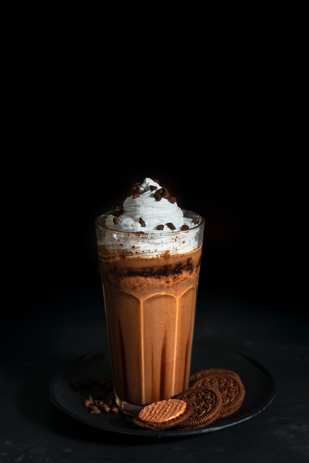 brown and white ice cream in clear glass cup