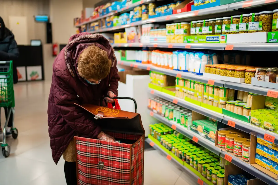 Best supermarket milk chocolate by Chocolate Brands woman in brown leather jacket holding brown leather handbag