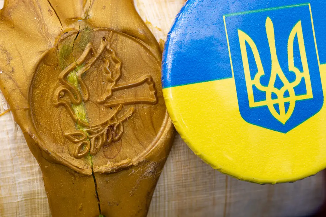 a close up of a wooden object with a coat of arms on it
