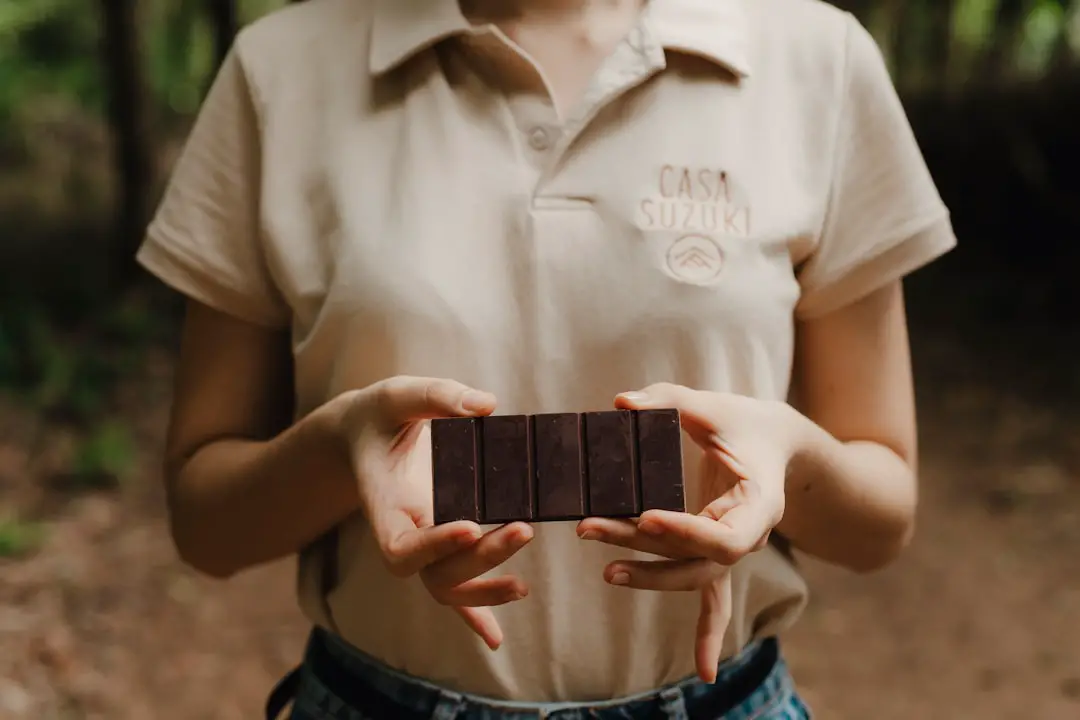 A woman holding a chocolate bar in her hands