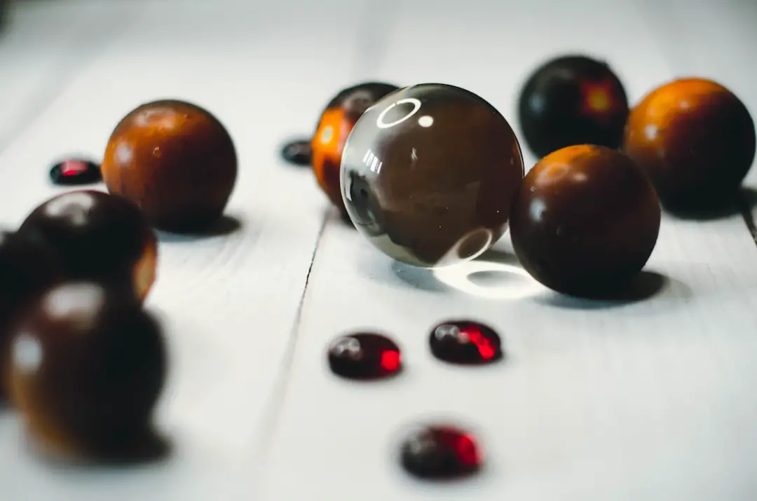 brown round fruit on white surface