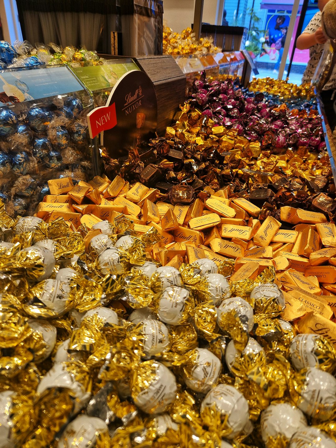 FAQ: Your Burning Chocolate Questions Answered by Chocolate Brands a large display of gold and silver jewelry